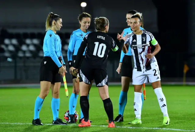 Arianna Caruso shakes hands with Kim Little