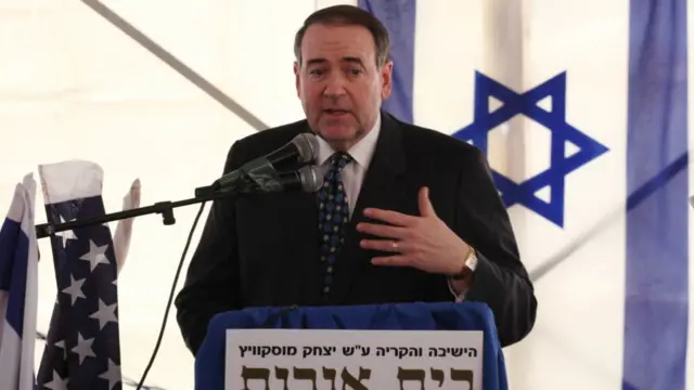 Mike Huckabee speaks during a corner stone dedication ceremony for a new Jewish settlement in East Jerusalem in 2011