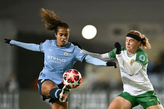 Mary Fowler (L) fights for the ball with Hammarby's Julie Blaksta