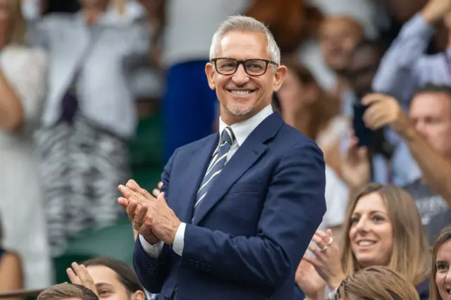 Gary Lineker applauds at Wimbledon