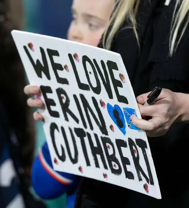 Sign reading 'We love Erin Cuthbert'