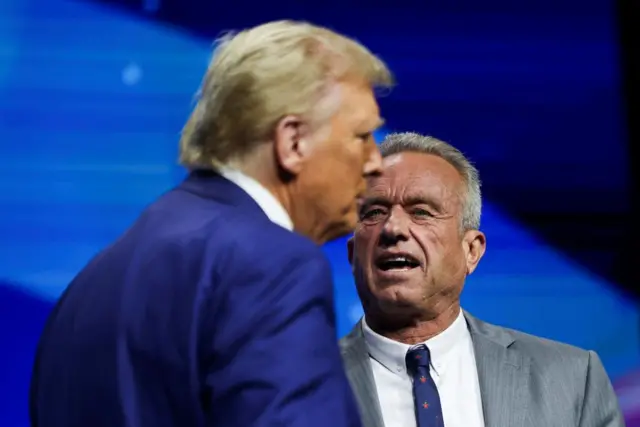 Robert F Kennedy Jr and Republican presidential nominee and former U.S. President Donald Trump attend a campaign event sponsored by conservative group Turning Point USA, in Duluth, Georgia, U.S., October 23, 2024.