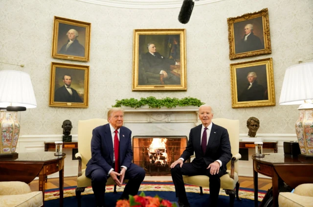 Donald Trump and Joe Biden sit in the Oval Office.