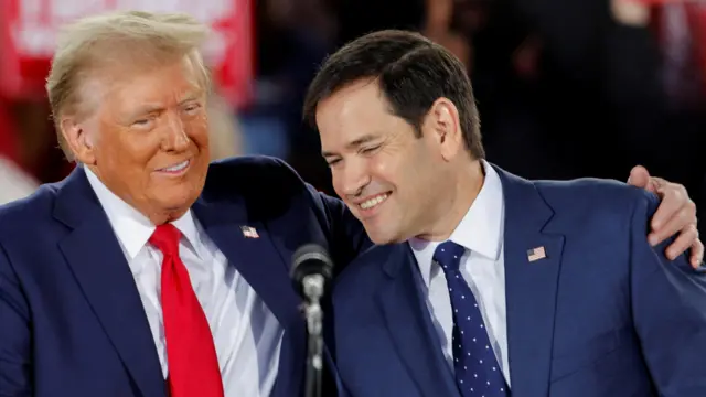 Republican presidential nominee and former U.S. President Donald Trump and Senator Marco Rubio (R-FL) react during a campaign event