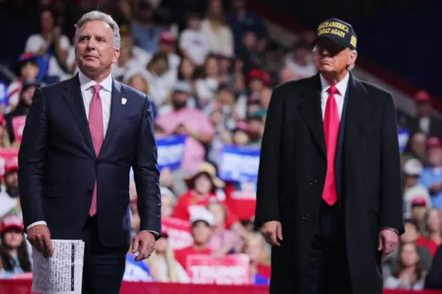 Businessman Steve Witkoff stands onstage with Republican presidential nominee and former U.S. President Donald Trump during a campaign rally at Atrium Health Amphitheater in Macon, Georgia, U.S., November 3, 2024.