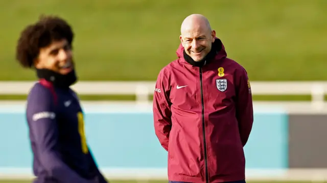 England interim manager Lee Carsley with Rico Lewis during training