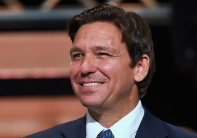 Headshot of Ron DeSantis smiling