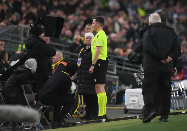 Referee Harm Osmers checking the monitor