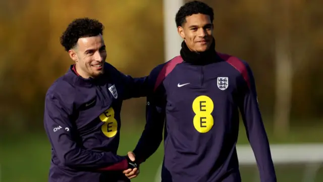 Curtis Jones and Jarell Quansah of England interact at St Georges Park.