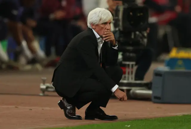 Jovanovic puts his hand to his mouth and kneels in his technical area