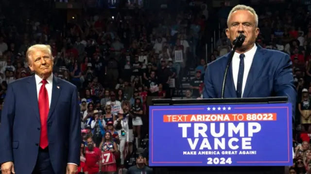 Former presidential candidate Robert F. Kennedy Jr. (R) speaks as Republican presidential nominee, former U.S. President Donald Trump listens during a campaign rally at Desert Diamond Arena on August 23, 2024 in Glendale, Arizona