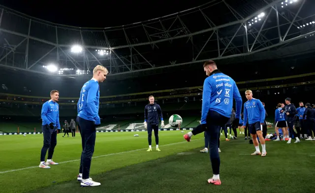 Finland warm up at the Aviva Stadium