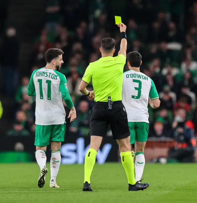 Callum O'Dowda being shown a yellow card