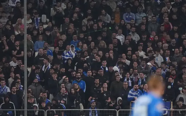 Greek fans shout support for their side