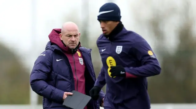 Lee Carsley looks on at England training