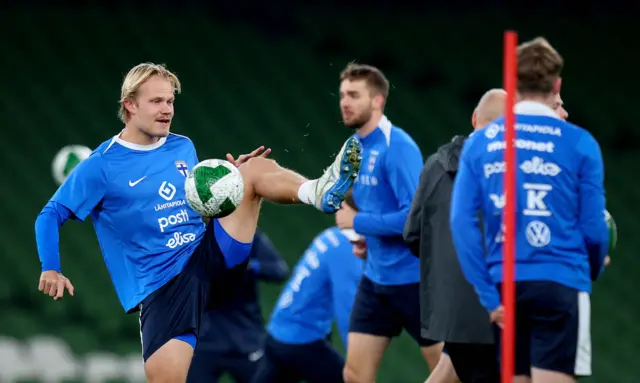 Finland warm up at the Aviva Stadium