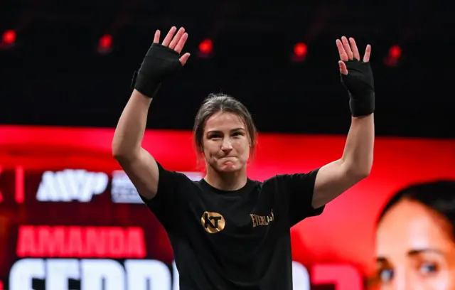 Katie Taylor holds up her hands