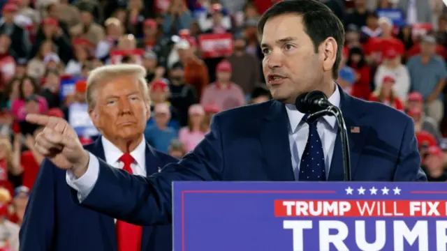 Trump stood Behind Rubio at a rally, as Rubio speaks and gestures