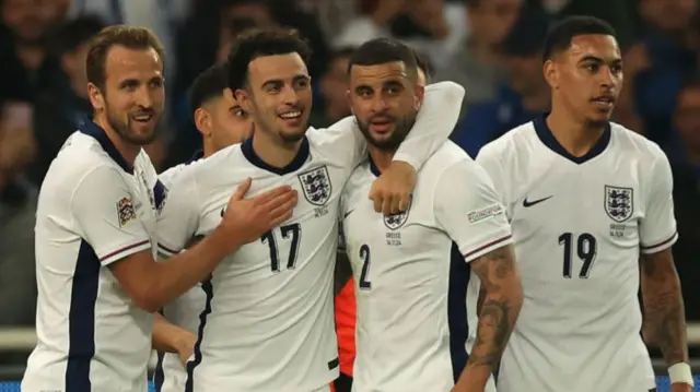Harry Kane and Kyle Walker join England players congratulating Curtis Jones after his goal against Greece