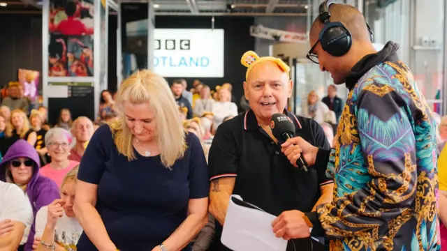 audience are speaking into mic