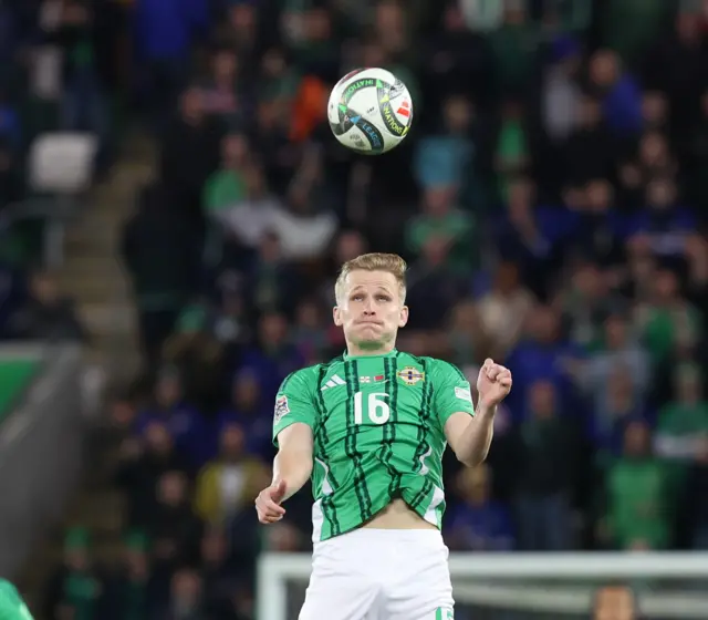 Ali McCann heading the ball during the Belarus game