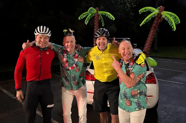 Sir Chris Hoy, Black Lace and Paddy McGuinness in a motorway service station car park