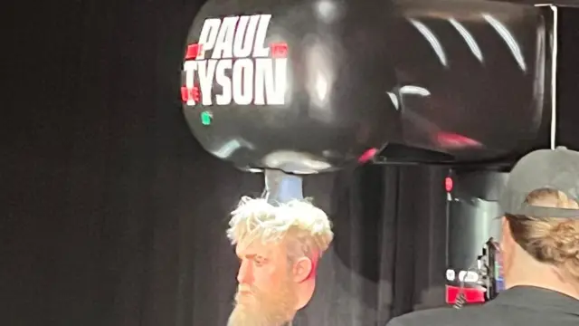 A punch machine with Jake Paul's face