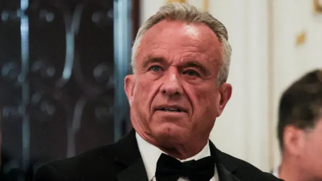 Robert F. Kennedy Jr wearing a black suit, white shirt and black bow tie.