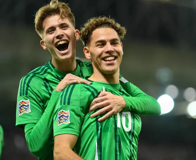 Isaac Price and Dion Charles celebrating Northern Ireland's second goal