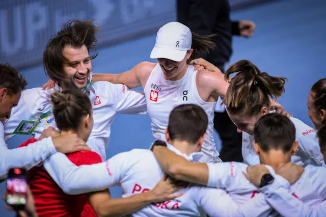 Poland celebrate after defeating Spain in the Billie Jean King Cup