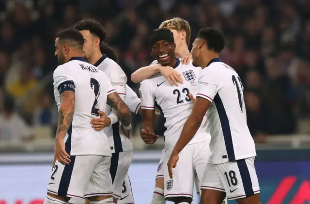 Noni Madueke of England is congratulated after teammate Ollie Watkins scores his team's first goal