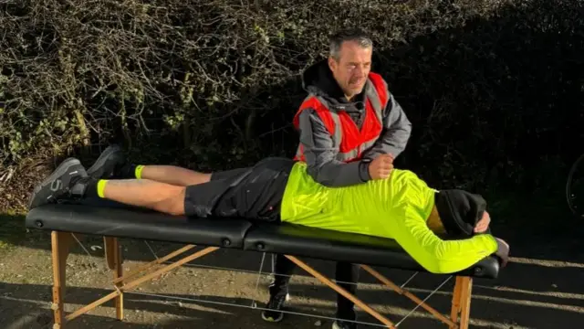 Jeff The Thumbs giving Paddy another massage on the massage table