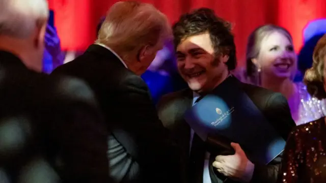 U.S. President-elect Donald Trump shakes hands with Argentine President Javier Milei at the America First Policy Institute (AFPI) gala at Mar-A-Lago in Palm Beach, Florida, US.