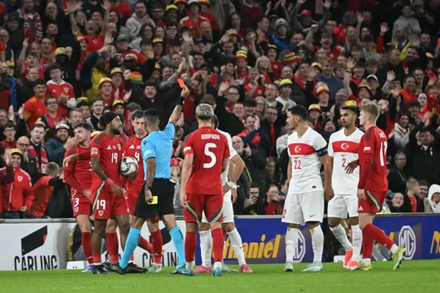 Baris Alper Yilmaz of Turkey receives a red card during the UEFA Nations League B, Group 4 match between Wales and Turkiye at Cardiff City Stadium in Cardiff, Wales on September 06, 2024.