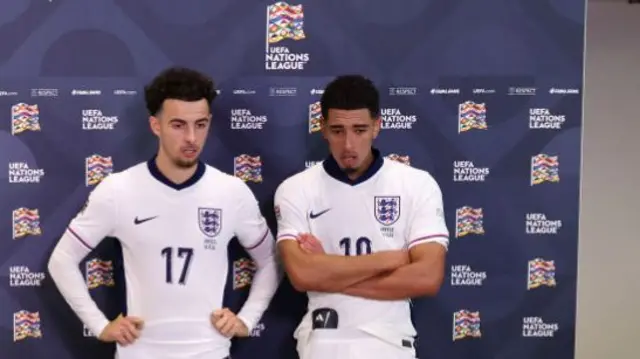 Curtis Jones and Jude Bellingham prepare for their post-match interview with ITV Sport