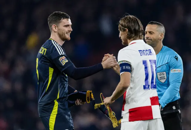 Scotland captain Andy Robertson shakes hands with his Croatia counterpart Luka Modric