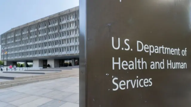 A sign marks the entrance to the US Department of Health and Human Services headquarters building