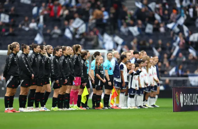 Players line up before kick off