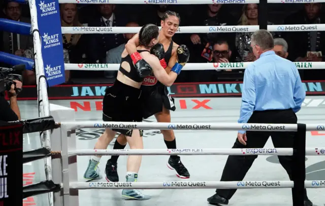 Katie Taylor hangs onto Amanda Serrano