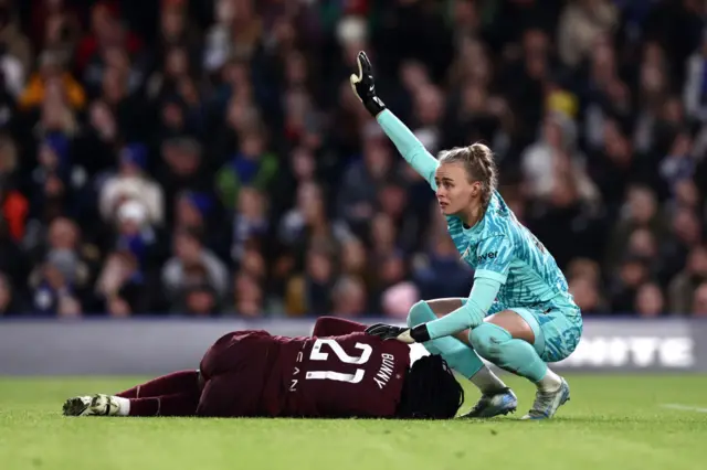 Hampton waves medics over as Shaw lays stricken on the floor