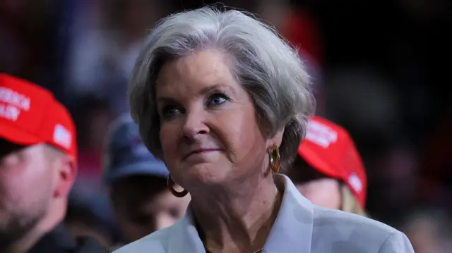 A file photo of Susie Wiles, with people behind her in red Make America Great Again hats