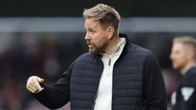 Crawley Town manager Rob Elliot gives instructions on the touchline