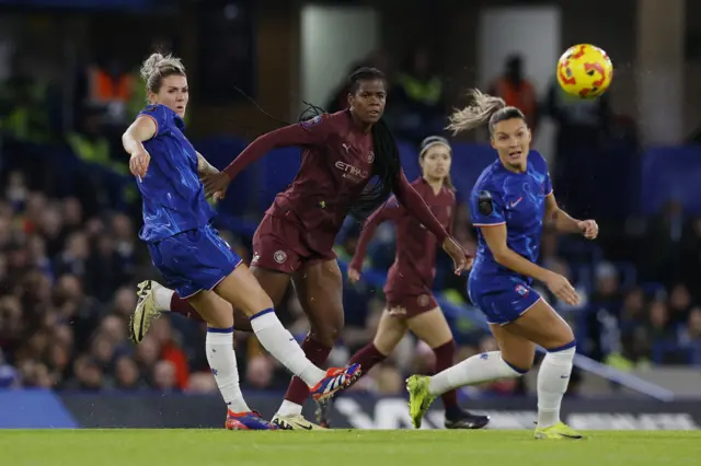 Brght and Shaw duel for the ball in midfield