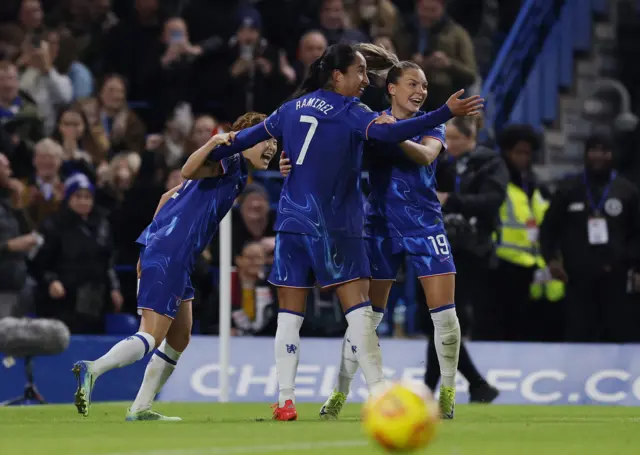 Ramirez celebrates with teammates after scoring the opener