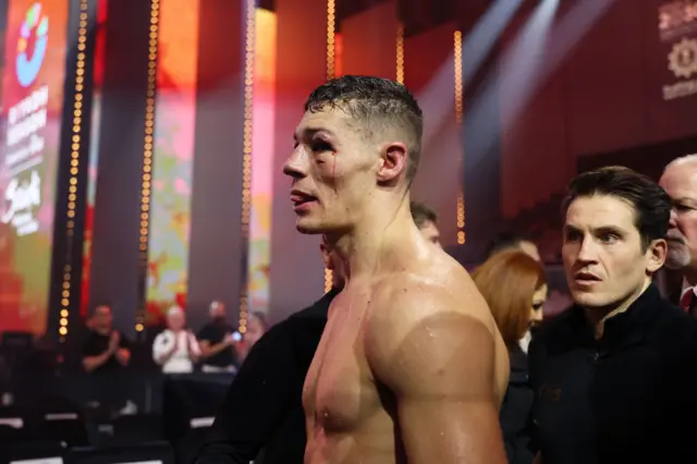 Chris Billam Smith is bloodied as he leaves the ring