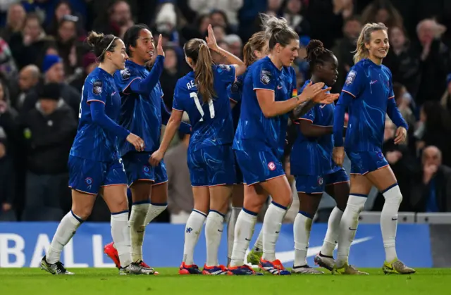 Chelsea players celebrate their second goal v Man City