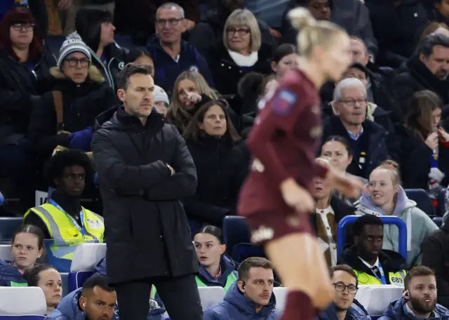 Gareth Taylor stands with arms crossed on the touchline