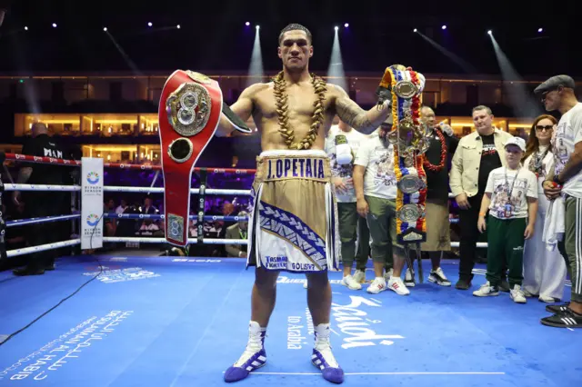 Jai Opetaia holding the Ring magazine belt