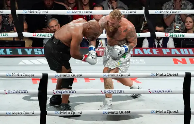 Mike Tyson slumps as he is punched by Jake Paul