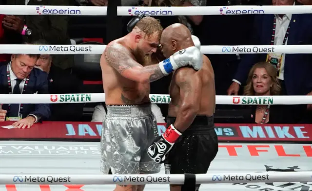 Jake Paul embraces Mike Tyson